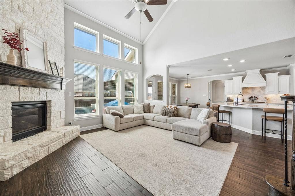 2816 Driftwood Creek Trail, Celina, TX 75078 Family room open to the kitchen with floor to ceiling stone fireplace.