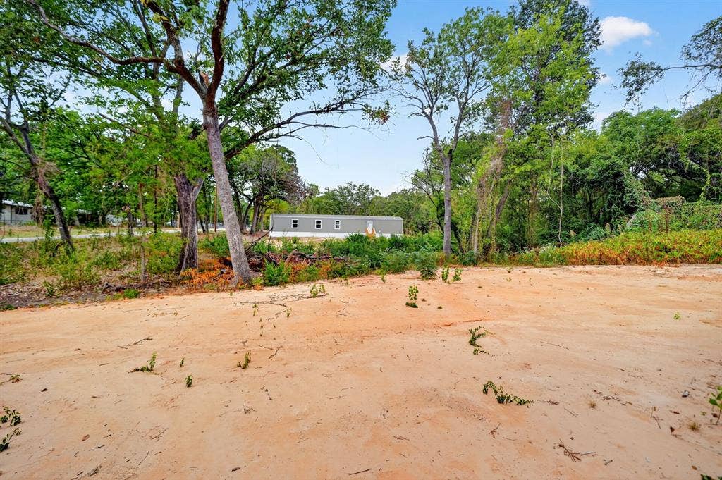 222 W Acres Road, Gun Barrel City, TX 75156 Expansive lot featuring mature native trees and significant open space