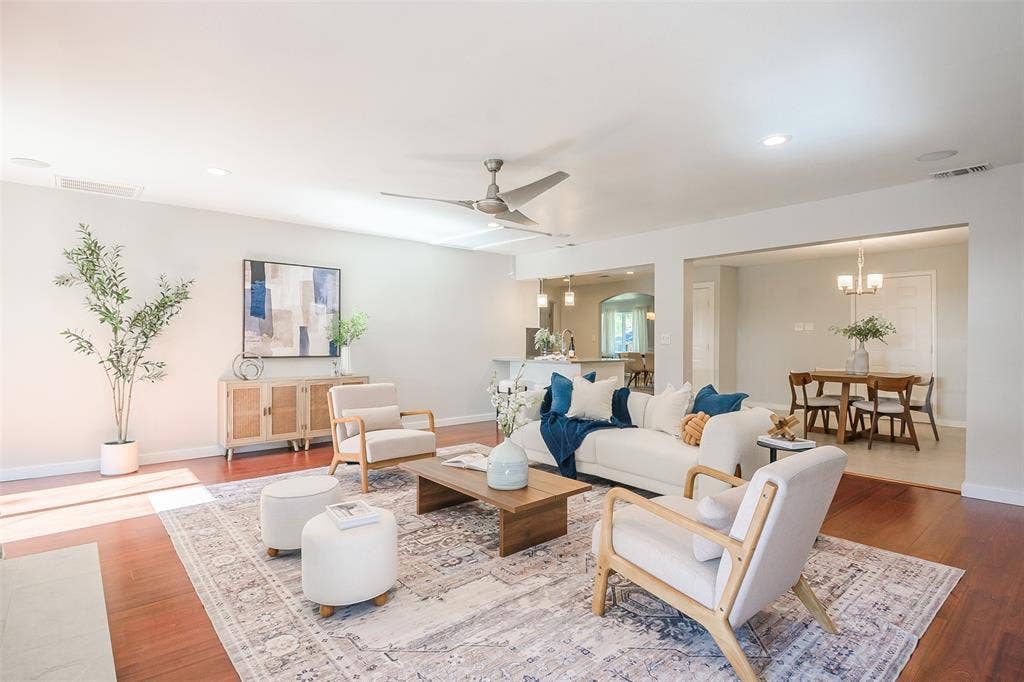 8050 Fall River Drive, Dallas, TX 75228 Open-concept interior featuring wood-finish flooring, recessed lighting, and a brushed-metal ceiling fan
