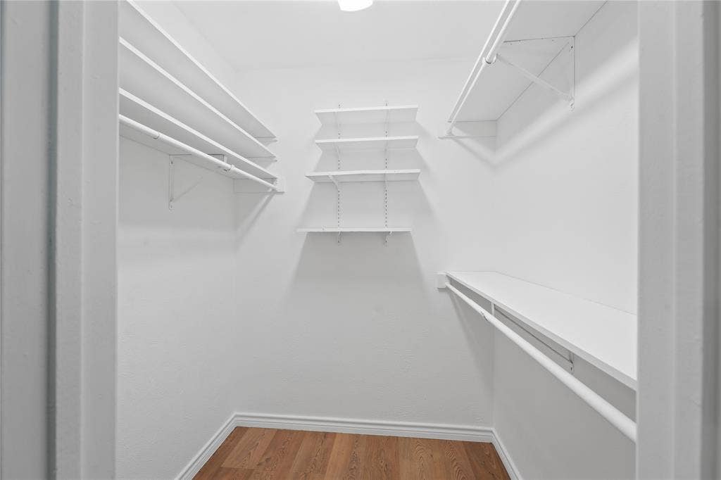 9214 Vagas Drive, Rowlett, TX 75088 Walk in closet with wood-type flooring