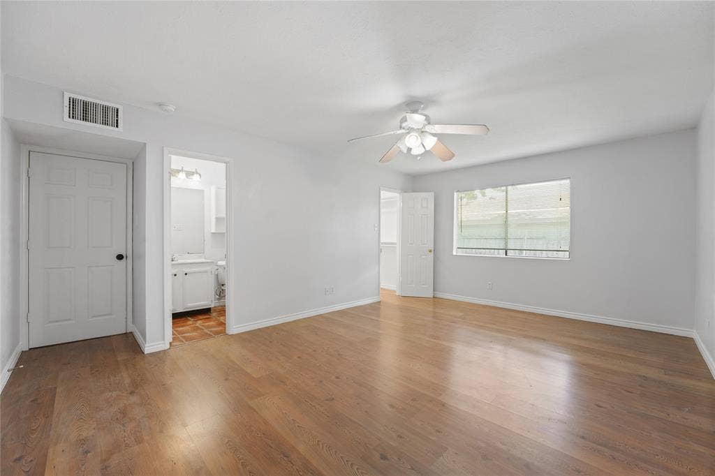 9214 Vagas Drive, Rowlett, TX 75088 Spare room with wood-type flooring and ceiling fan