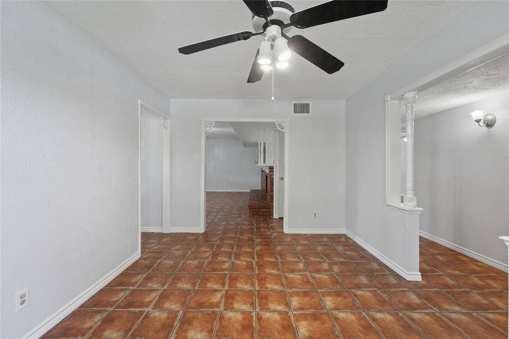 9214 Vagas Drive, Rowlett, TX 75088 Tiled spare room featuring ceiling fan