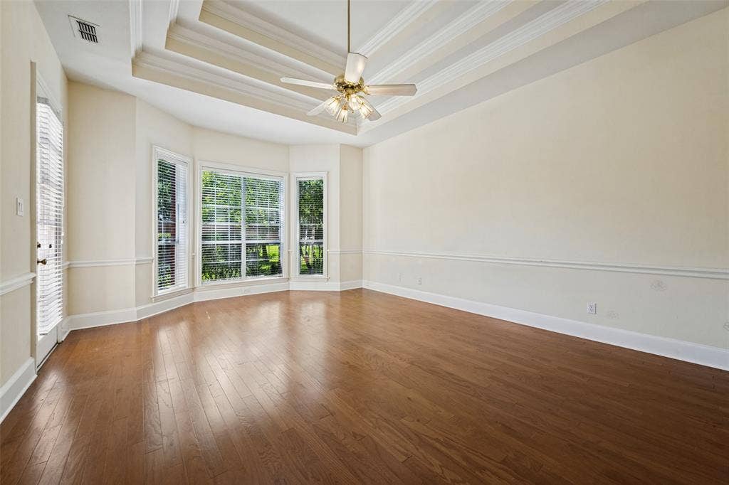 Primary bedroom overlooking backyard