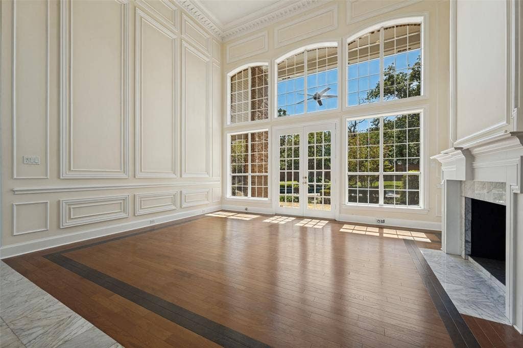 Formal living room with tons of natural light