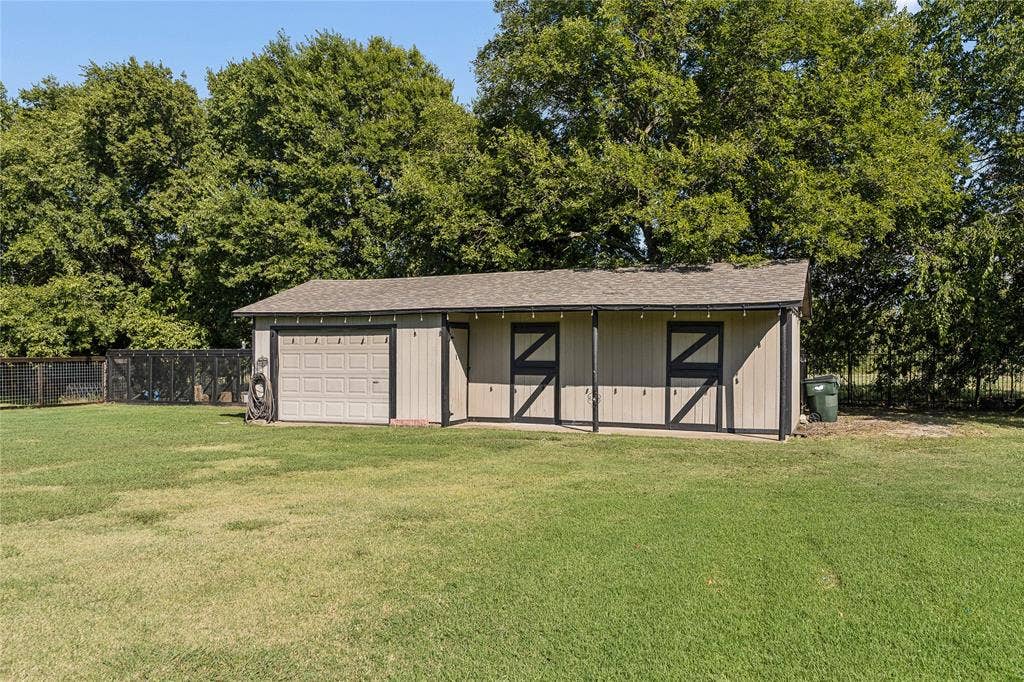 2 stall horse barn and a 3rd garage bay. Chicken coop is off the barn as well.