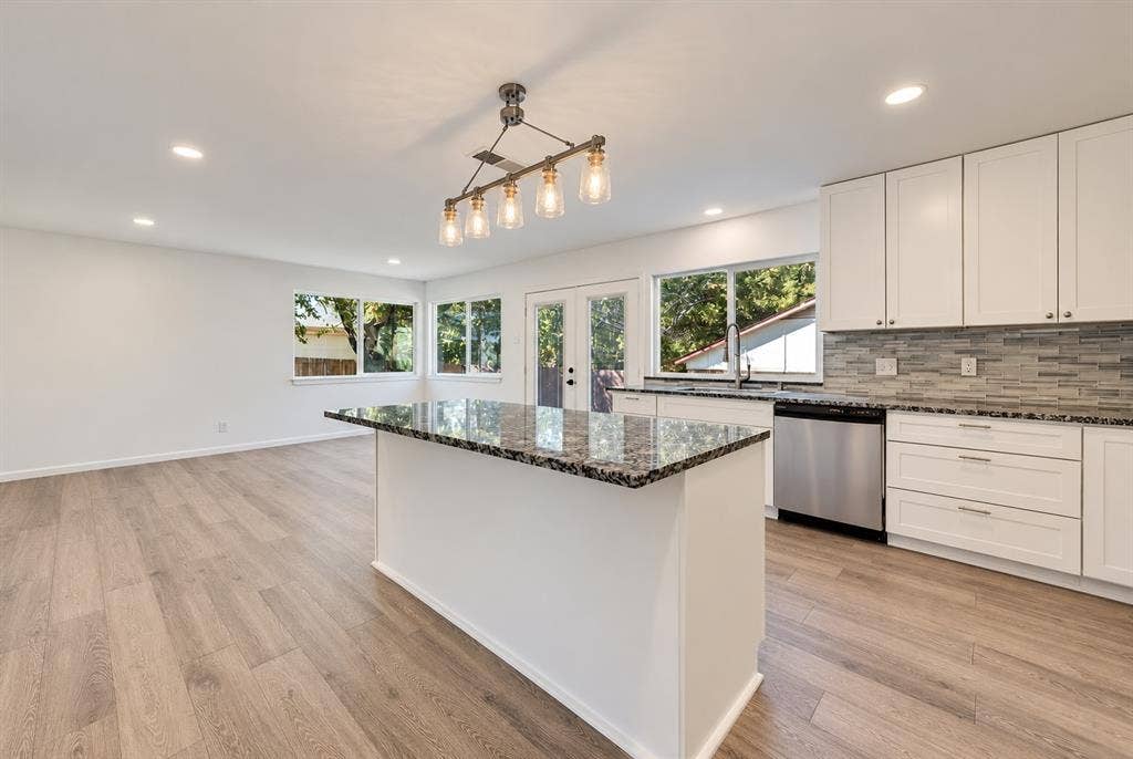 Open kitchen with  flex-space as breakfast, dining or second living area.
