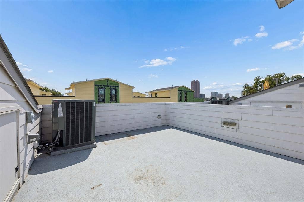 1901 N Carroll Avenue, #104, Dallas, TX 75204 Rooftop terrace featuring horizontal wood-plank style siding and a durable surface finish