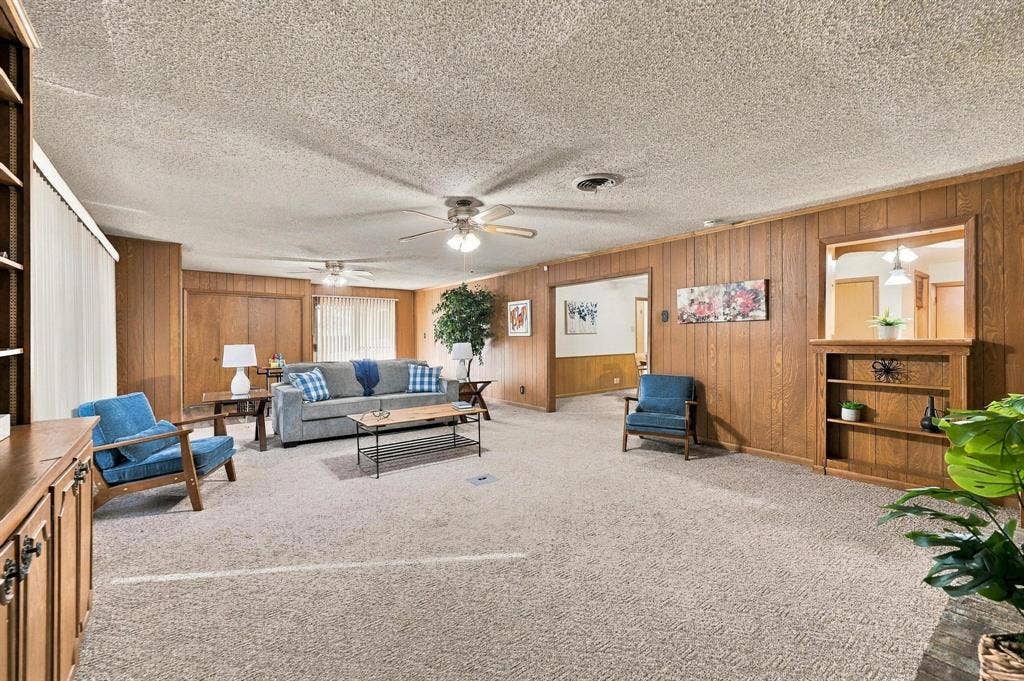 Wood paneling, with custom built in shelves and natural lighting