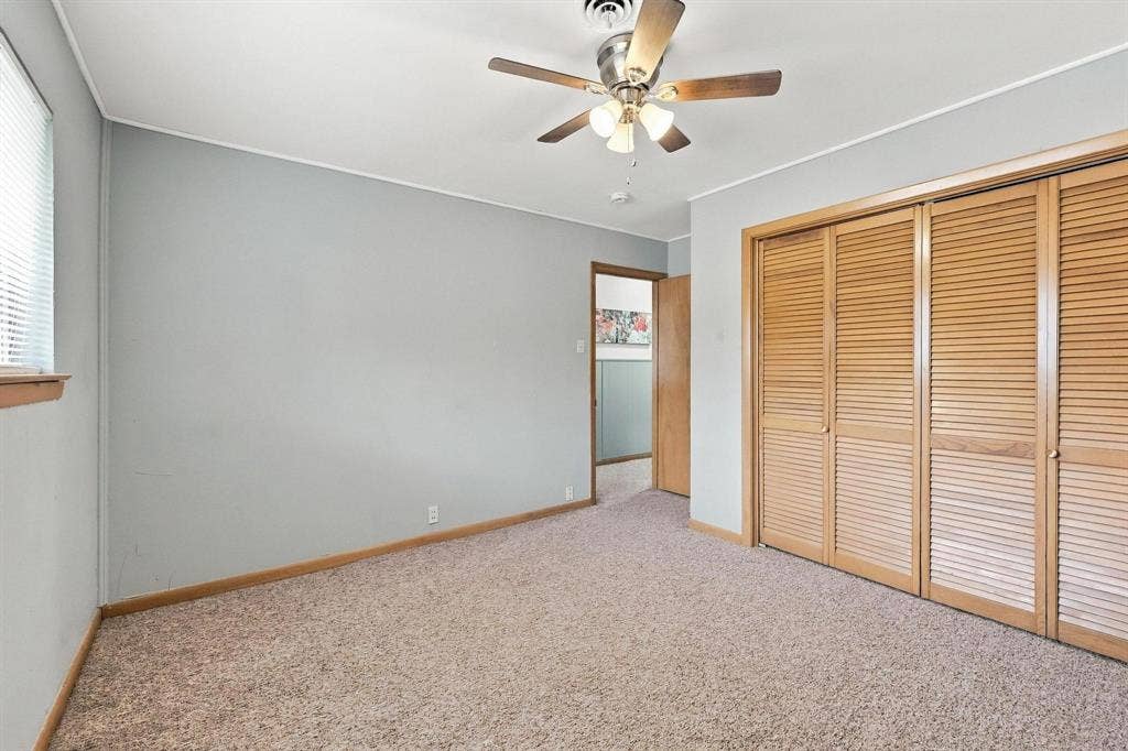 Large bedroom with natural lighting and plenty of closet space