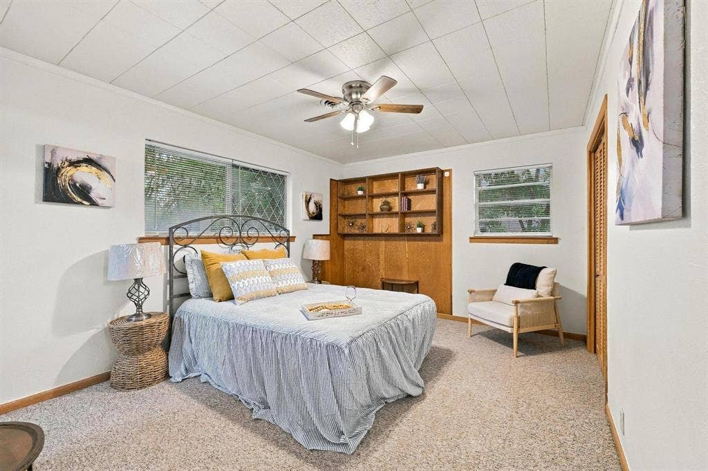 Built in cabinets, natural light with access to ensuite.