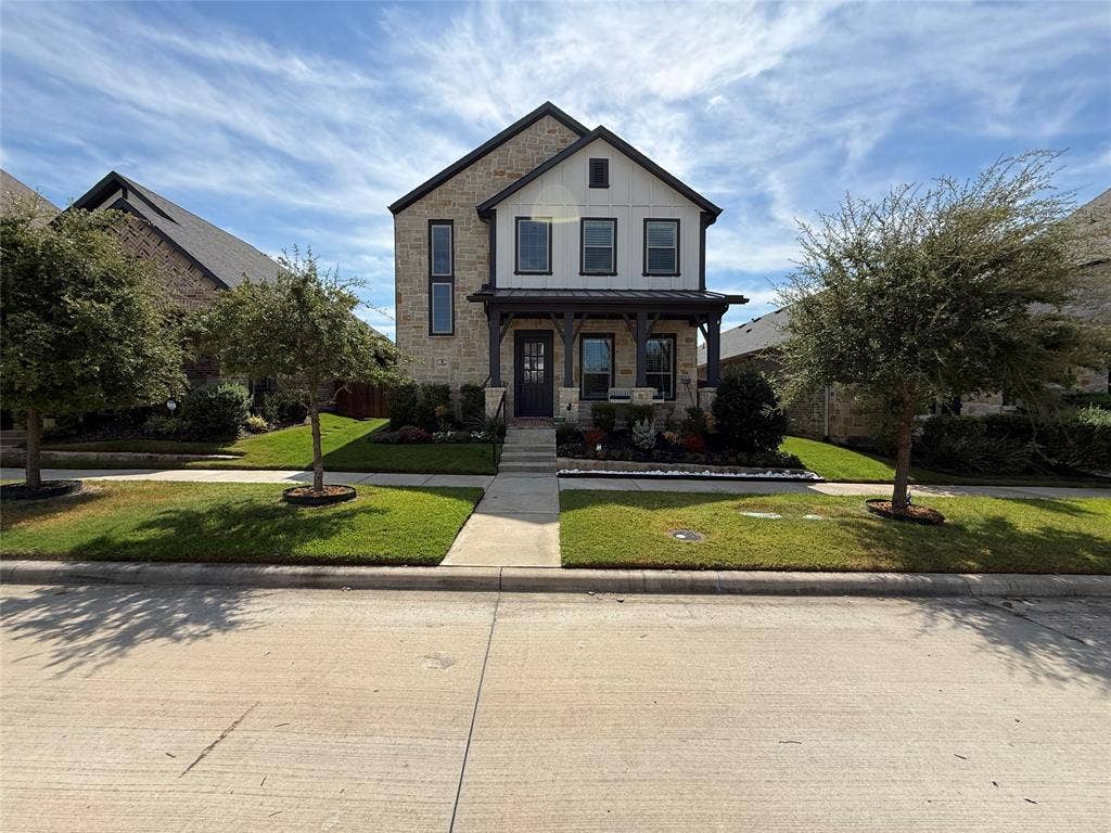 12905 Yale Court, Frisco, TX 75035 Two-story exterior featuring a stone and siding facade, a covered front porch with timber-style posts, a multi-gabled roofline, and a manicured front lawn