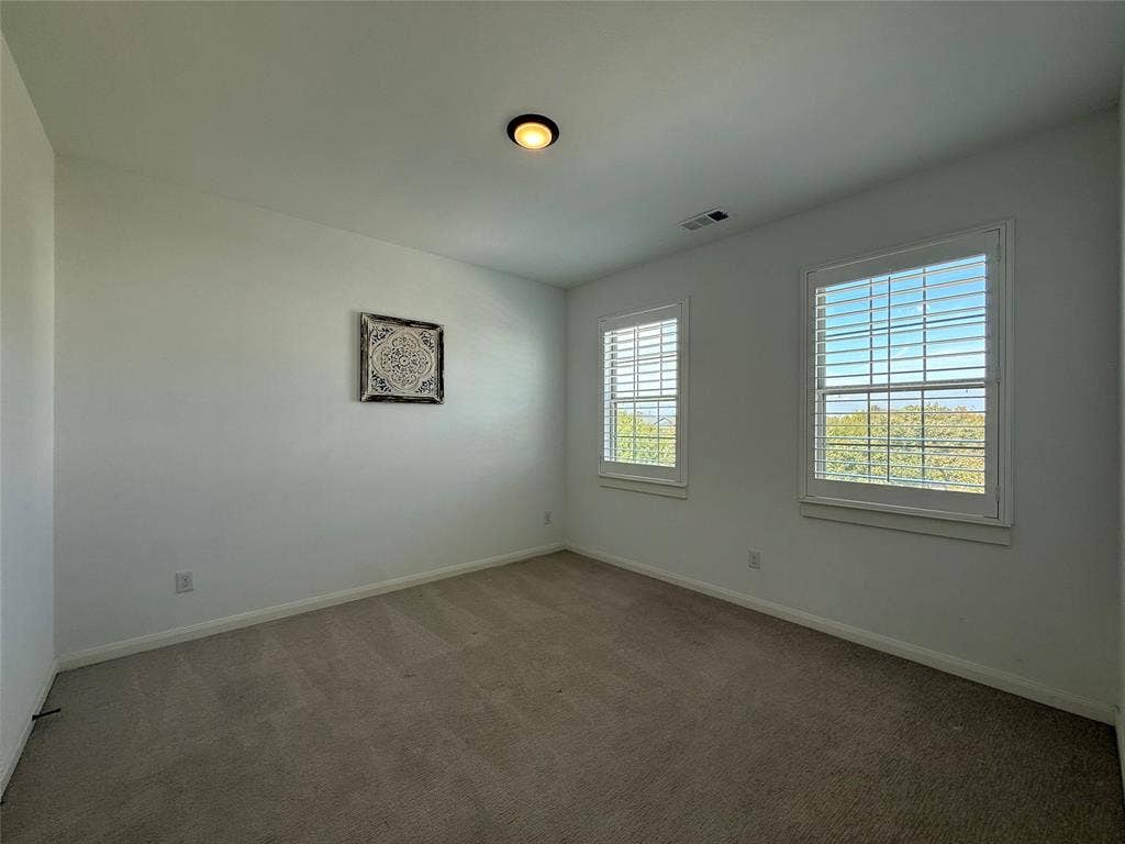 12905 Yale Court, Frisco, TX 75035 Neutral-toned wall-to-wall carpeting, dual windows with plantation shutters, and flush-mount ceiling lighting