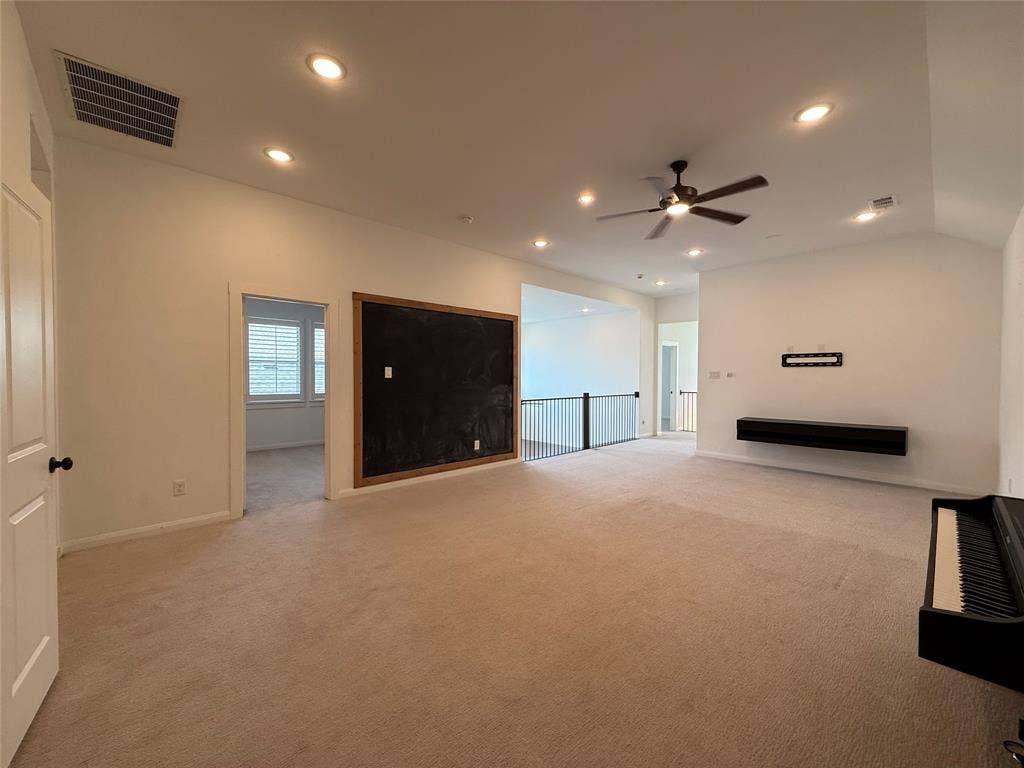 12905 Yale Court, Frisco, TX 75035 Vaulted ceilings featuring recessed lighting, a ceiling fan, a wall-mounted floating shelf, and a built-in chalkboard