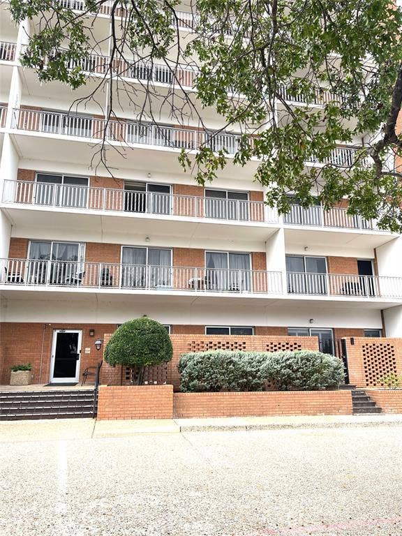 4924 Cobbs Drive, #1H, Waco, TX 76710 Side Entrance- 1H courtyard behind round tree