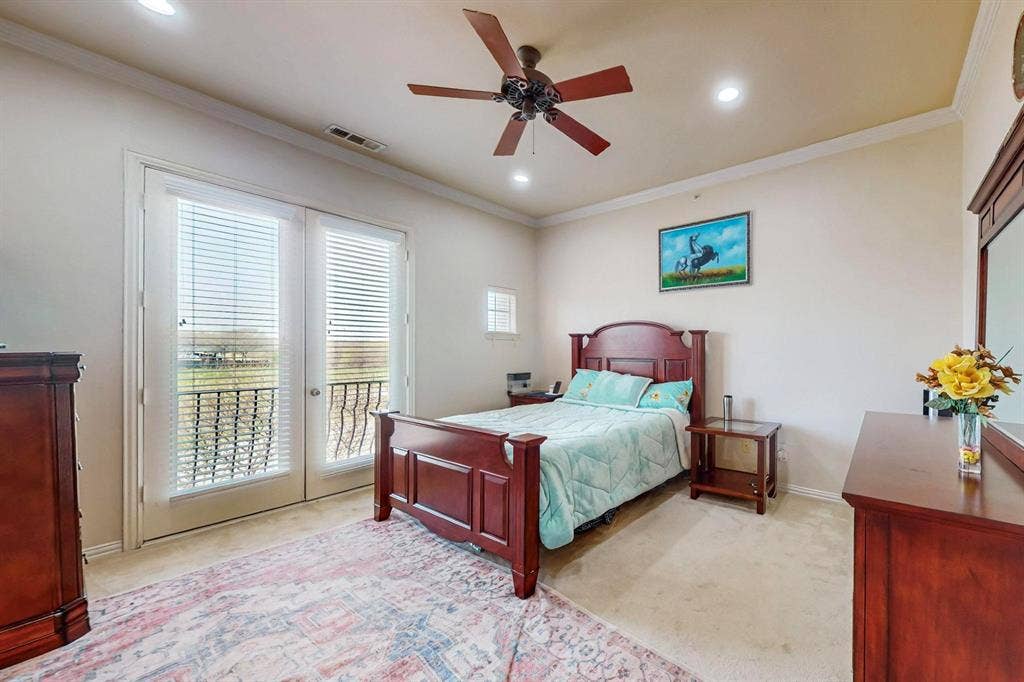 2606 Rue De Ville, Irving, TX 75038 Double glass-pane doors with integrated blinds, crown molding, recessed lighting, and a ceiling fan