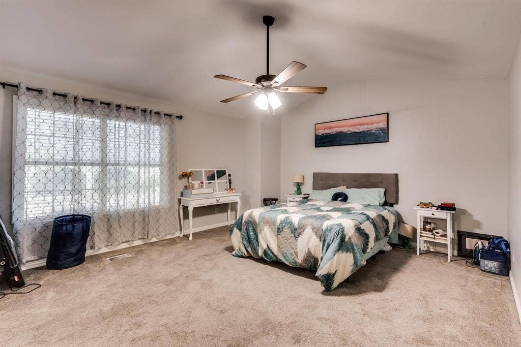 spacious primary bedroom with it's own private bathroom.