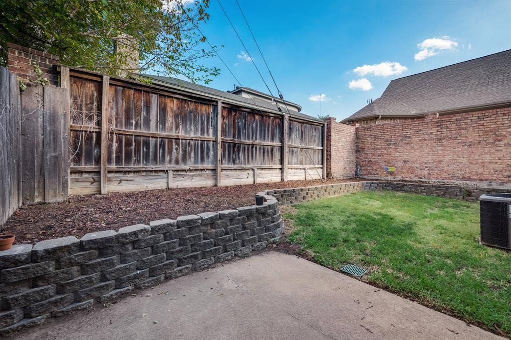 Backyard with its own flowerbed.