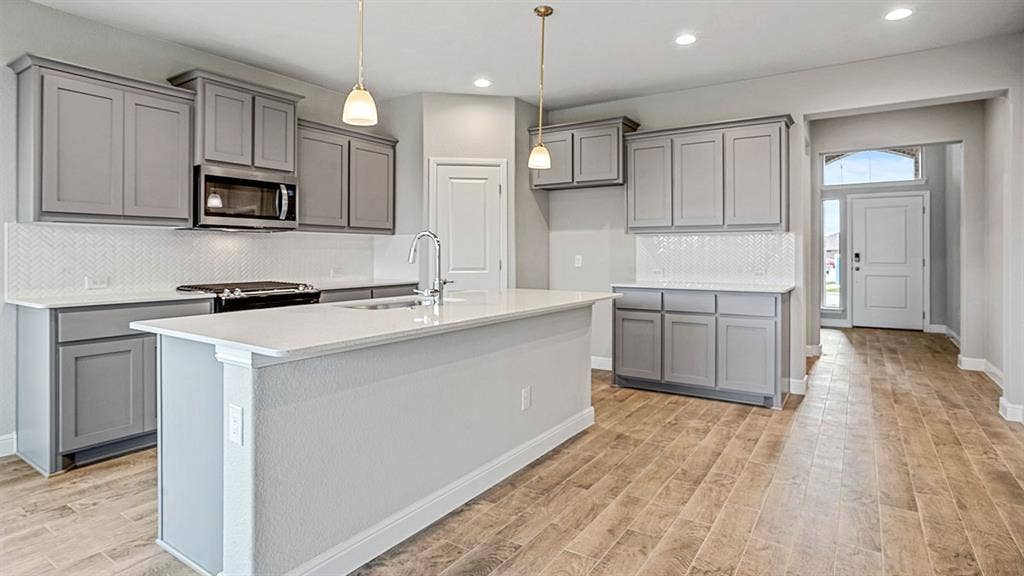 1426 CANTERBURY Trail, DeSoto, TX 75115 Kitchen - All Home and community information, including pricing, included features, terms, availability and amenities, are subject to change at any time without notice or obligation. All Drawings, pictures, photographs, video, square footages, floor plans, elevations, features, colors and sizes are approximate for illustration purposes only and will vary from the homes as built.