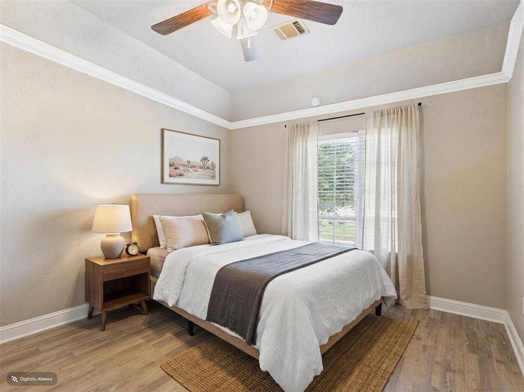 1201 E Iberian Court, Granbury, TX 76048 Room featuring tray ceilings, crown molding, wood-finish flooring, and a ceiling fan