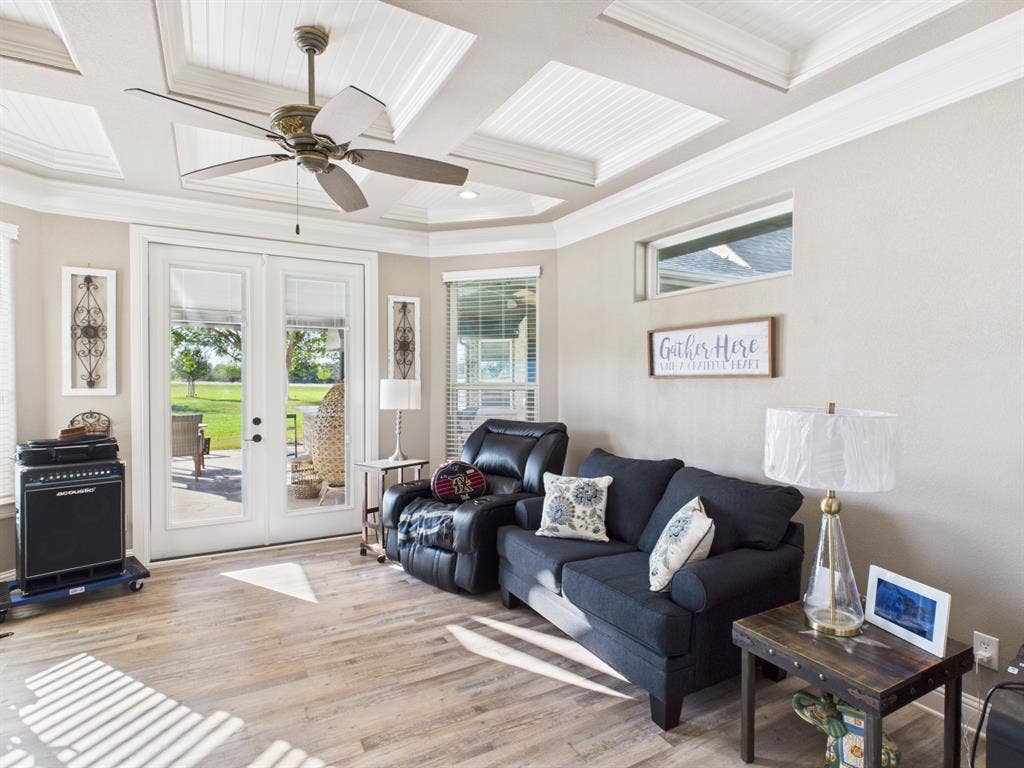 1201 E Iberian Court, Granbury, TX 76048 Coffered ceiling featuring recessed beadboard panels, wood-finish flooring, dual glass-paned doors, and a transom window