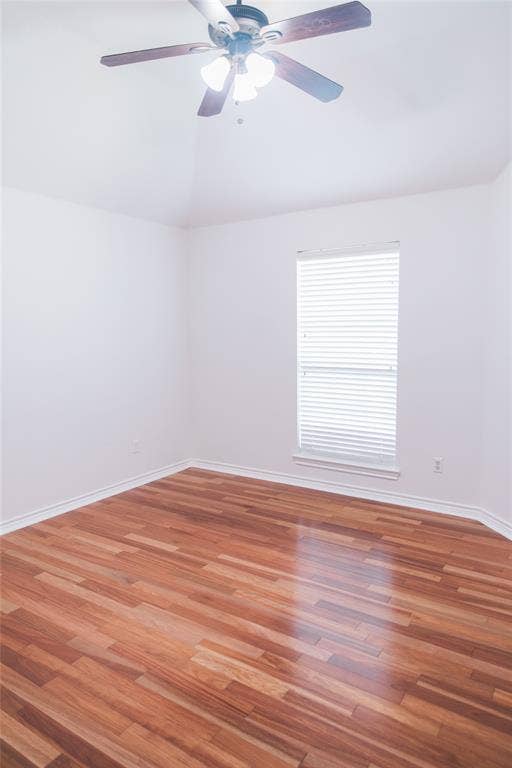 404 Belmont Court, Lewisville, TX 75067 Vaulted ceilings, wood-finish flooring, and a ceiling fan with integrated lighting
