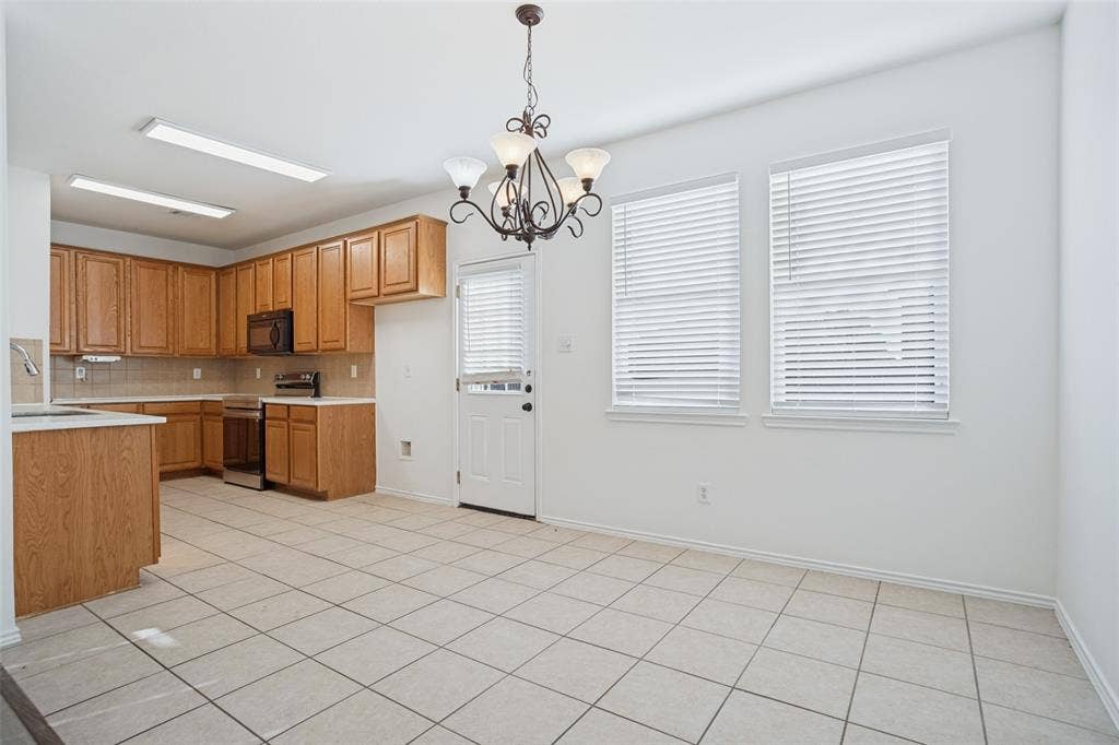 1507 Bankston Drive, Wylie, TX 75098 Kitchen featuring wood cabinetry, ceramic tile flooring, recessed lighting, and a multi-arm chandelier