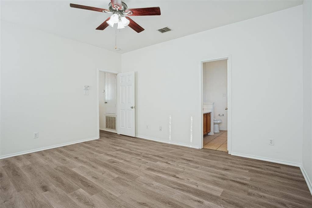 1507 Bankston Drive, Wylie, TX 75098 Room featuring wood-finish flooring, a ceiling fan with integrated lighting, and white six-panel interior doors