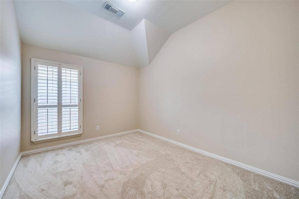 1441 Kirkwood Lane, Prosper, TX 75078 Vaulted ceiling, neutral wall tones, wall-to-wall carpeting, and interior plantation shutters