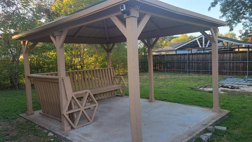 707 Korgan Street, Dallas, TX 75216 Covered outdoor structure featuring a concrete foundation, timber-frame construction, and a built-in wooden bench