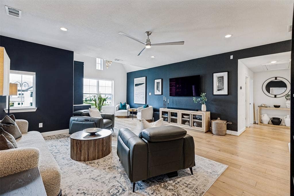 4604 Devon Drive, Parker, TX 75002 Open-concept living space featuring vaulted ceilings, wood-finish flooring, recessed lighting, and a modern ceiling fan