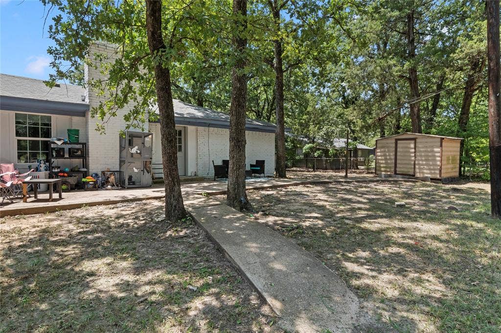 110 Pierce Drive, Mabank, TX 75156 Partially fenced yard with storage shed