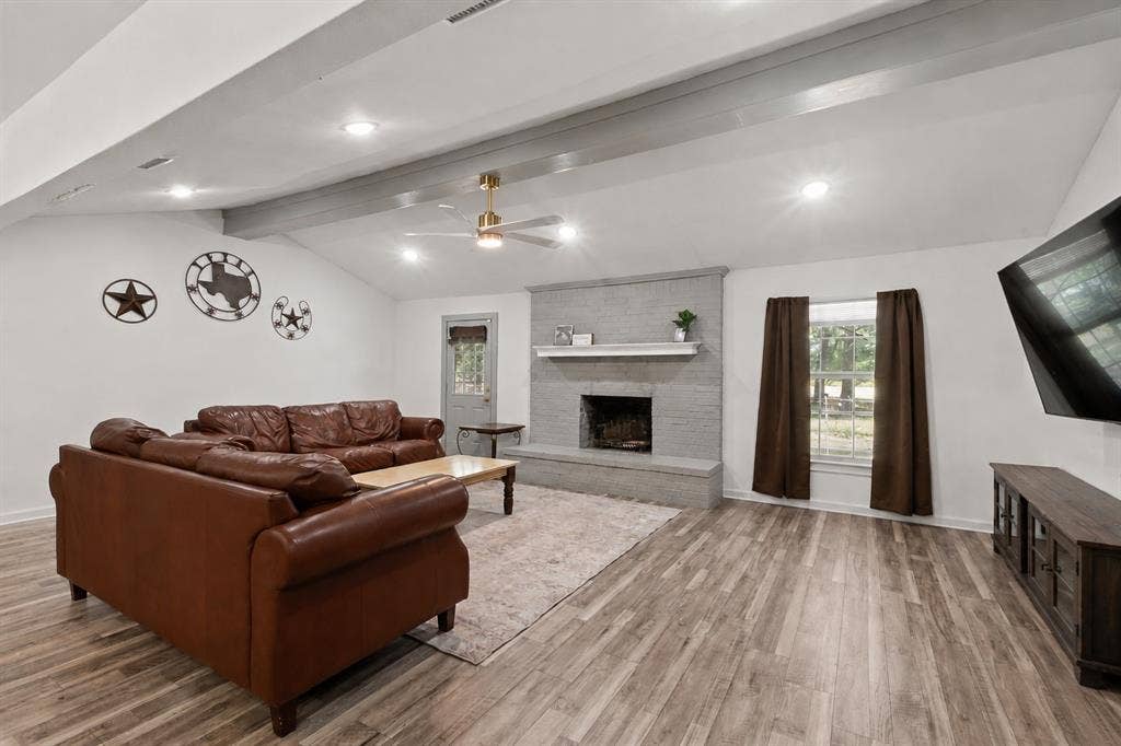 110 Pierce Drive, Mabank, TX 75156 Luxury Vinyl Plank flooring and wood burning fire place.