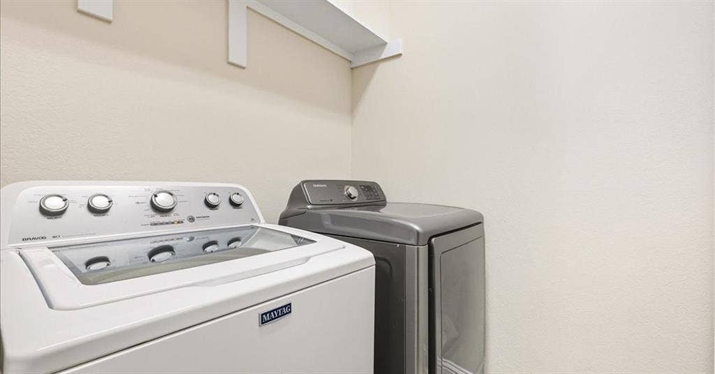 632 Grisham Drive, Fate, TX 75087 Utility area featuring wall-mounted storage shelving