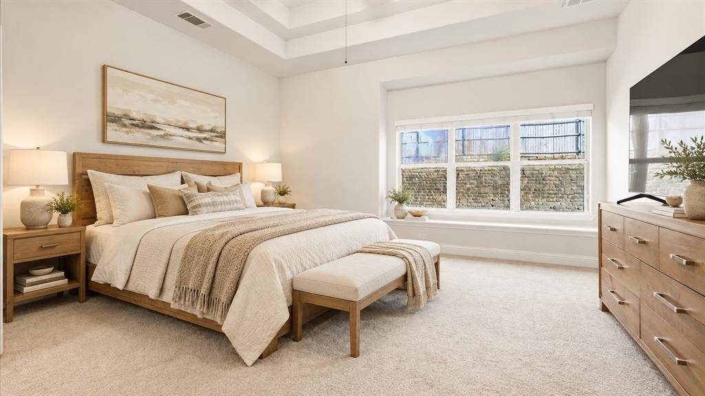 632 Grisham Drive, Fate, TX 75087 Tray ceiling, window seat with built-in ledge, and neutral wall-to-wall carpeting