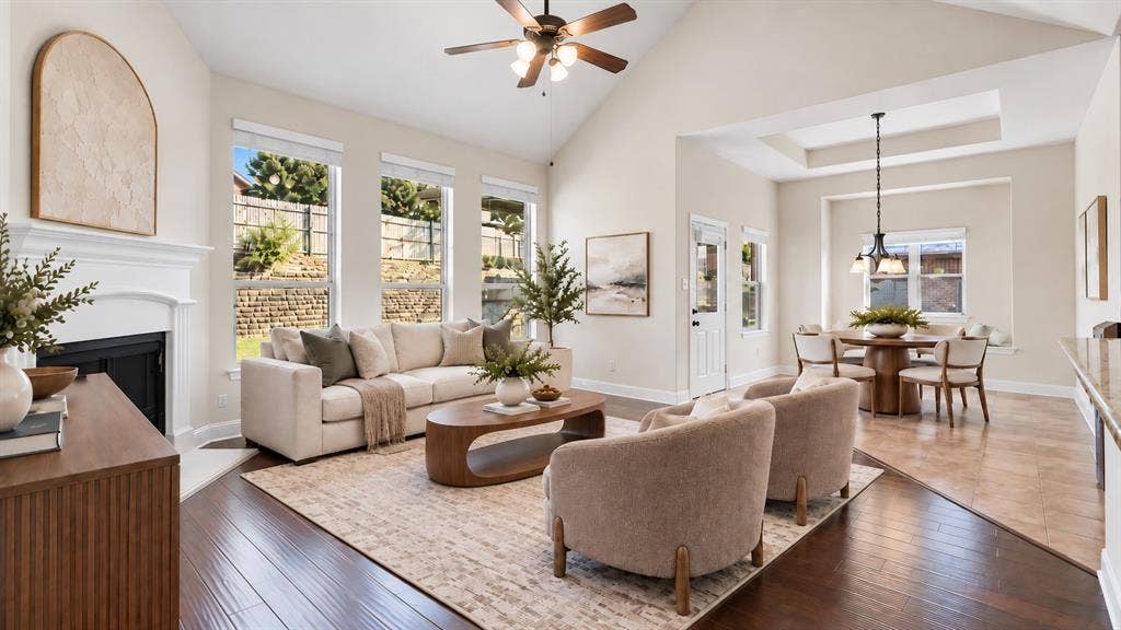 632 Grisham Drive, Fate, TX 75087 Vaulted ceilings, fireplace with decorative mantel, wood-finish flooring, tile flooring, and oversized windows