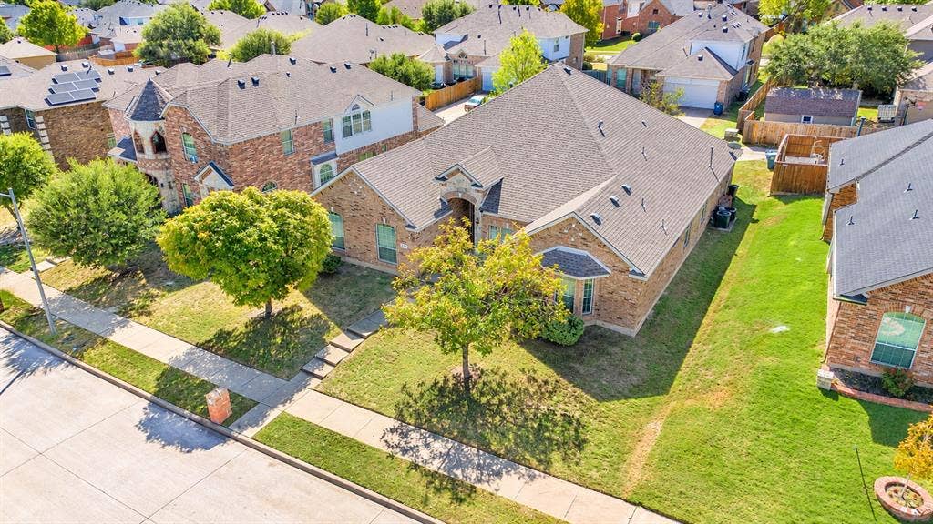 1736 Blue Stream Drive, DeSoto, TX 75115 Single story brick exterior featuring architectural accents, and mature trees on an interior lot
