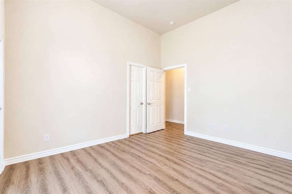 1736 Blue Stream Drive, DeSoto, TX 75115 High ceilings, wood-look LVP flooring, and two interior panel doors