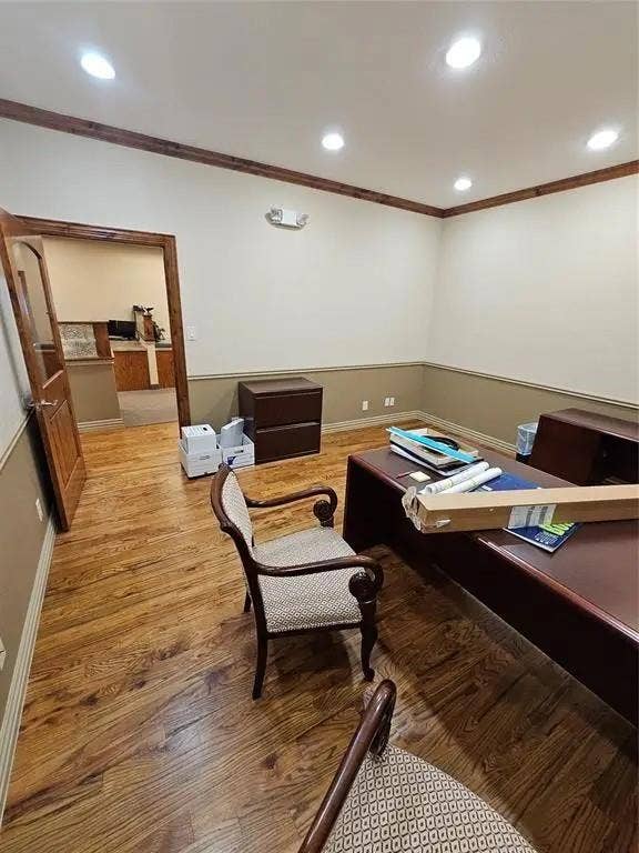 1831 W Louisiana Street, McKinney, TX 75069 Interior space featuring wood-finish flooring, two-tone wall treatment, crown molding, recessed lighting, and a solid wood entry door