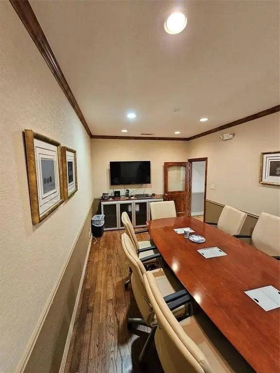 1831 W Louisiana Street, McKinney, TX 75069 Room featuring wood-finish flooring, crown molding, chair rail trim, recessed lighting, and a wood-framed door with glass inlay