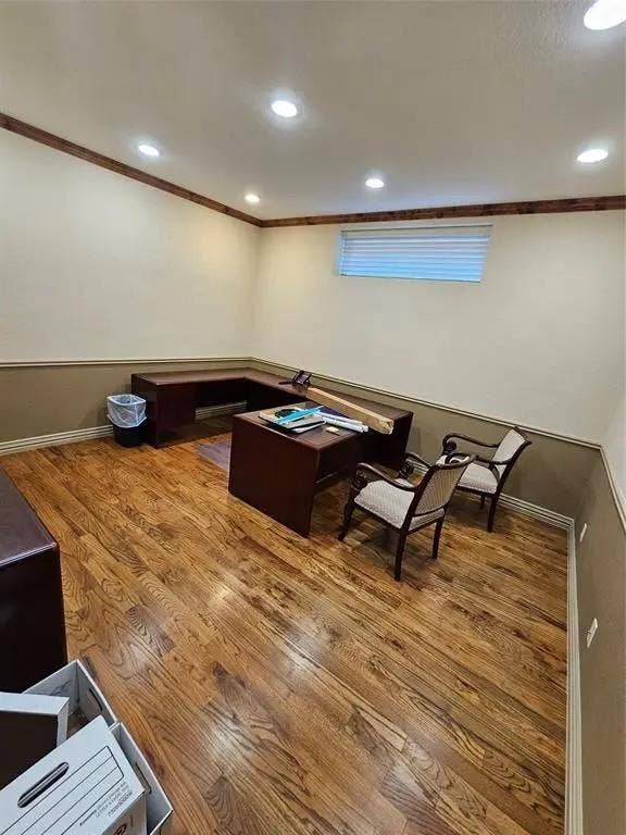 1831 W Louisiana Street, McKinney, TX 75069 Room featuring wood-finish flooring, recessed lighting, chair rail molding, and a high-set horizontal window