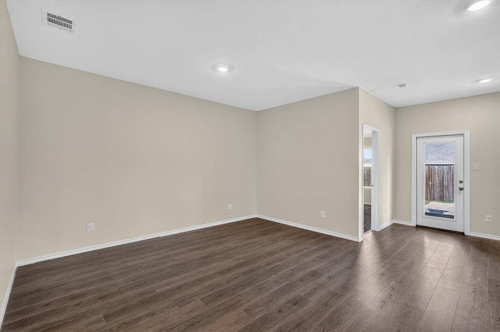 114 Real Quiet Lane, Caddo Mills, TX 75135 Neutral interior space featuring wood-finish flooring, recessed lighting, and a glass-paneled exterior door