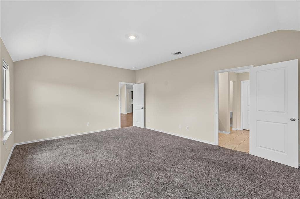 114 Real Quiet Lane, Caddo Mills, TX 75135 Vaulted ceilings, neutral wall tones, plush wall-to-wall carpeting, and solid-core two-panel interior doors
