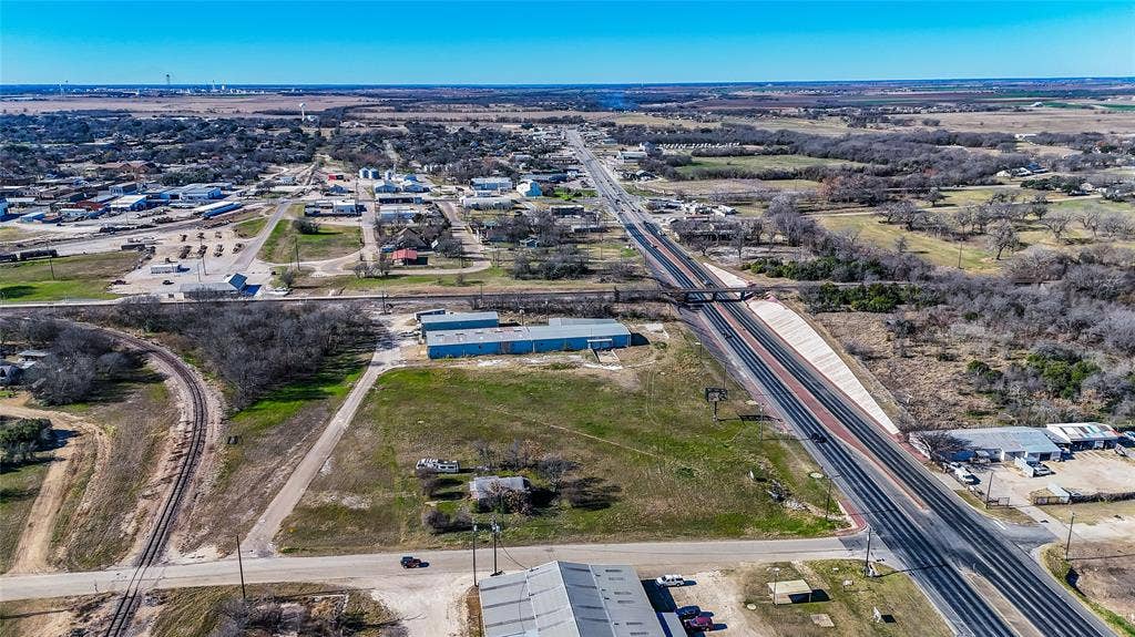 110 1st Street, McGregor, TX 76657 Aerial perspective of expansive acreage featuring direct proximity to regional thoroughfare and rail infrastructure