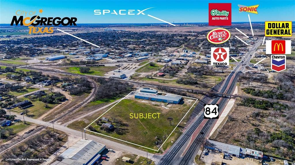 110 1st Street, McGregor, TX 76657 Aerial perspective of a corner lot featuring direct frontage on Highway 84 and a metal-sided commercial structure