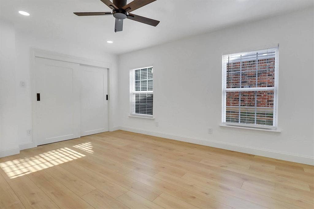1913 Sandra Kay Lane, Arlington, TX 76015 Interior room featuring wood-finish flooring, recessed lighting, a ceiling fan, sliding closet doors, and dual windows