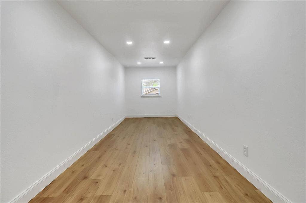 1913 Sandra Kay Lane, Arlington, TX 76015 Interior room featuring wood-finish flooring, recessed lighting, and a single window