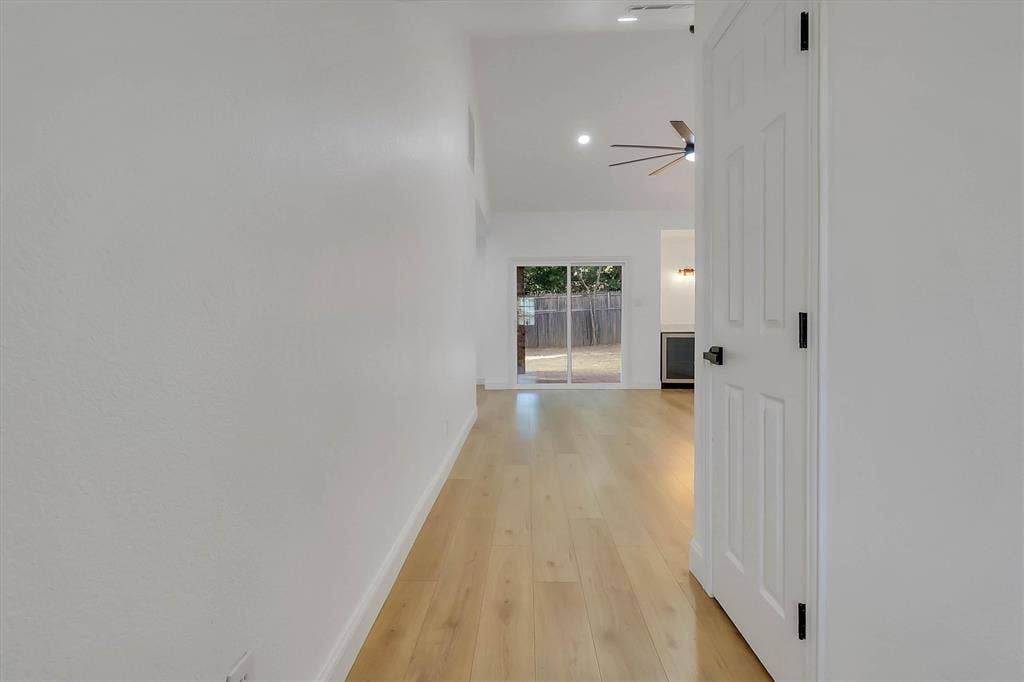 1913 Sandra Kay Lane, Arlington, TX 76015 Vaulted ceilings, wood-finish flooring, recessed lighting, ceiling fan, and glass sliding patio doors