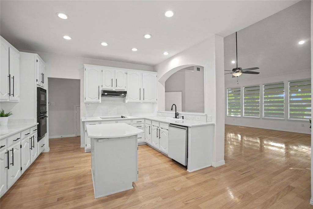 Designed to entertain- open concept to the family room and casual dining. Trending light hardwoods flow though-out, light and natural lighting.