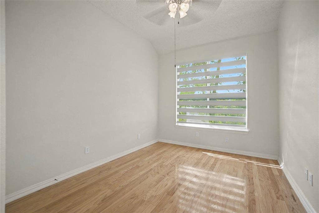 The 2nd Bedroom is downstairs with hardwoods, zebra blinds and closet.
