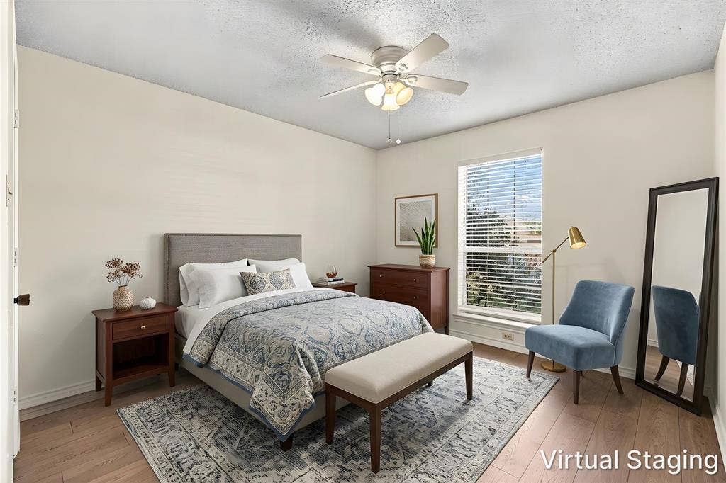 2145 Willow Place, #A, Carrollton, TX 75006 Wood-finish flooring, ceiling fan with integrated light fixture, and large window with horizontal blinds